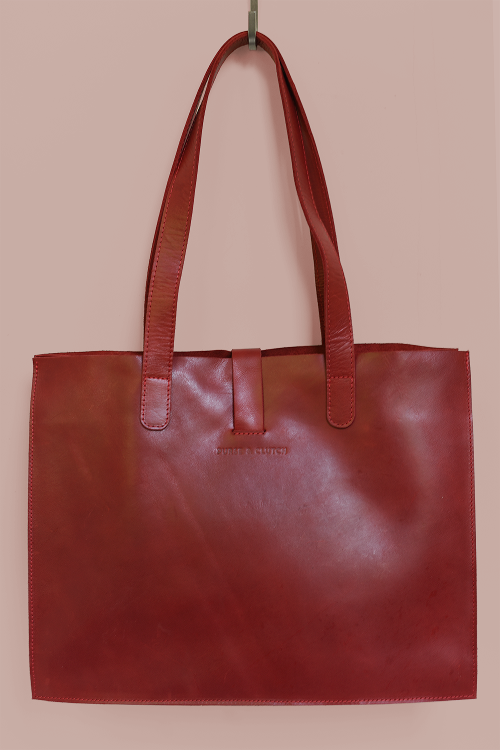 Ethically handmade red leather shoulder bag from Ethiopia