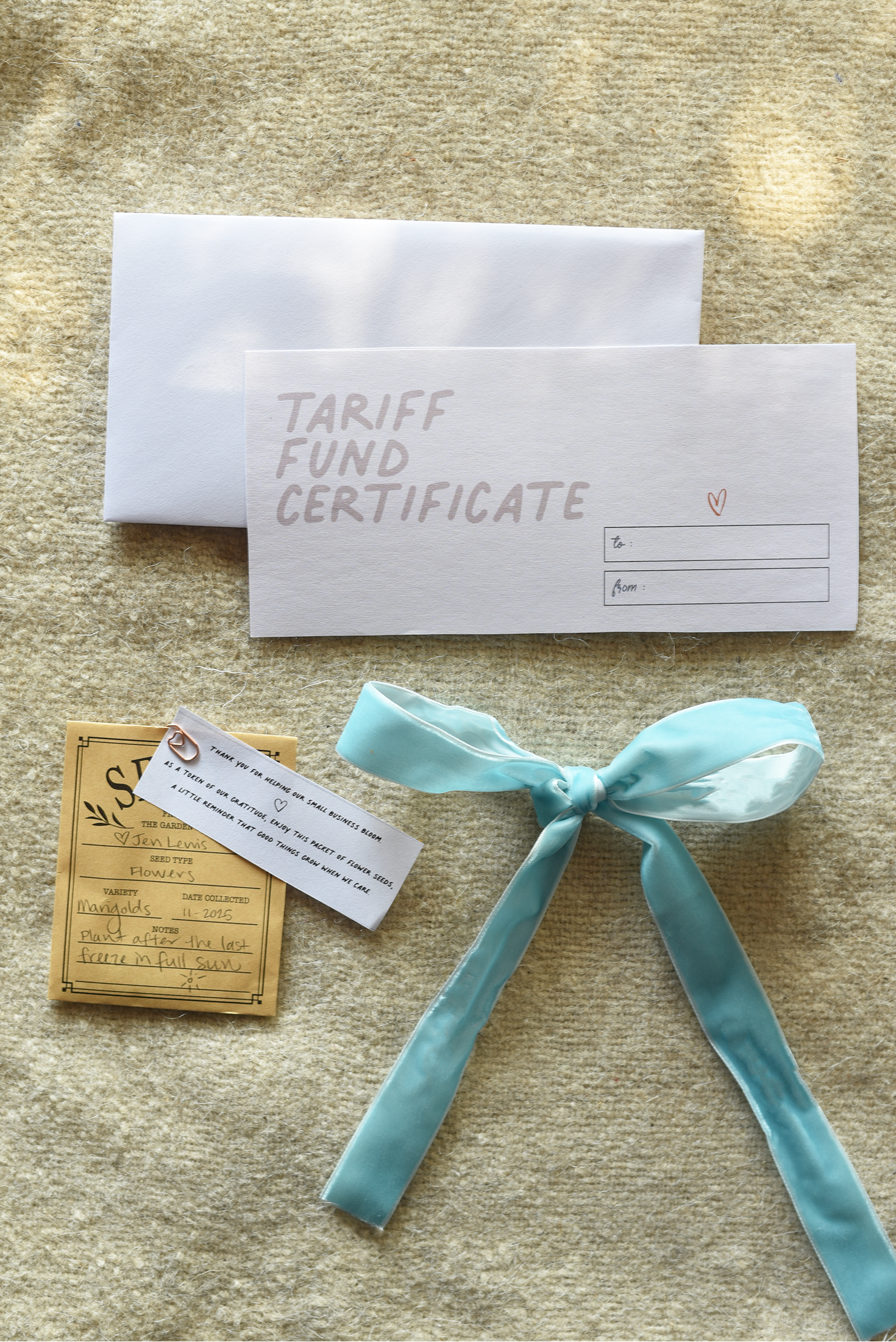 Tariff Fund Certificate with a blue ribbon on a textured surface